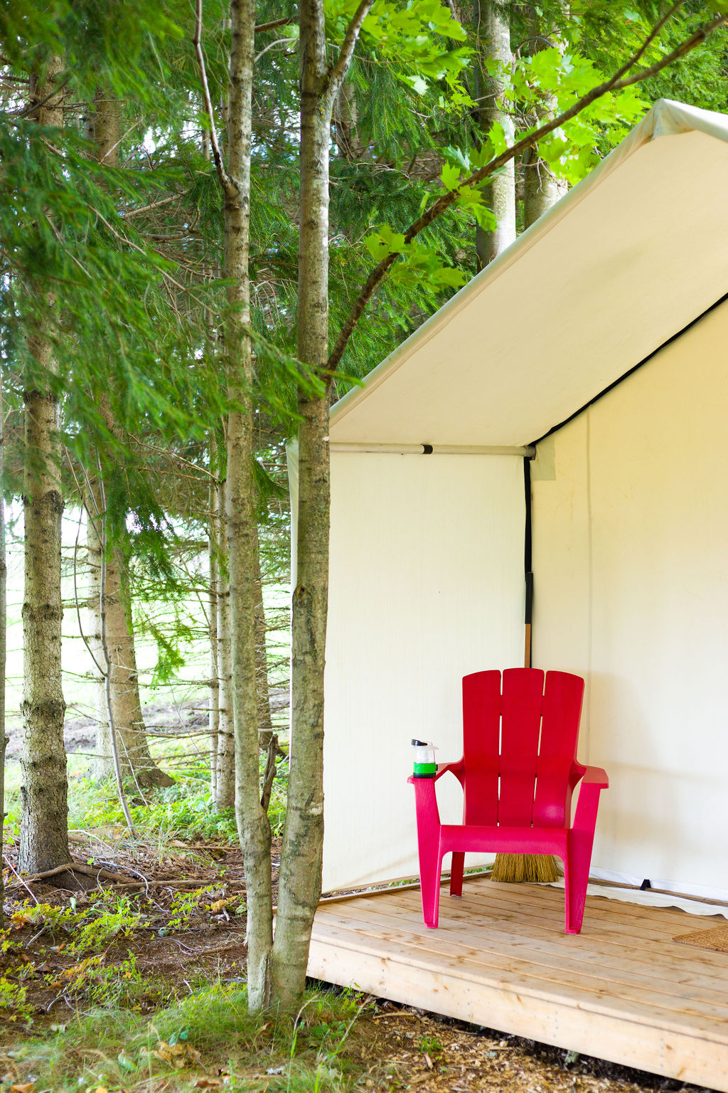 Glamping tents at Irvineside Farm offer private views enjoyed from the deck, with Muskoka chairs.