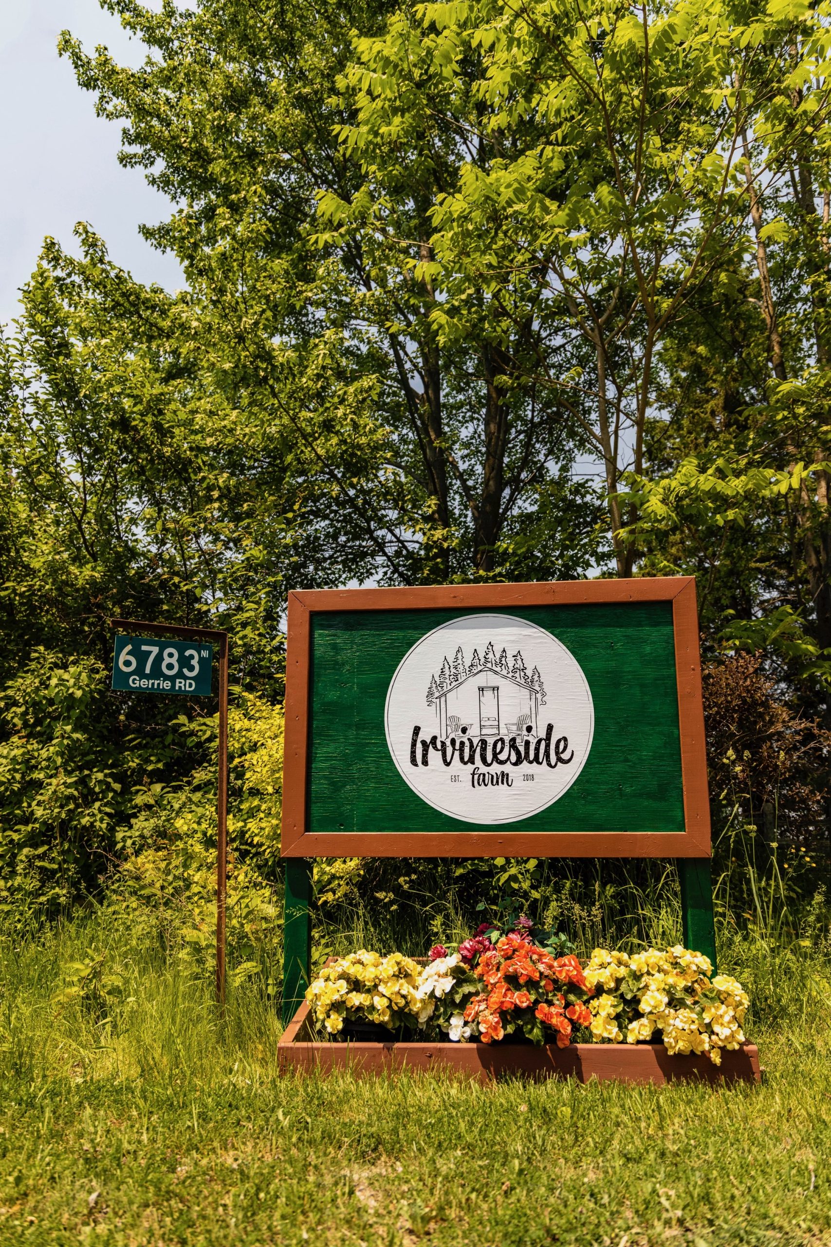 Irvineside Farm sign with logo at the end of the driveway.